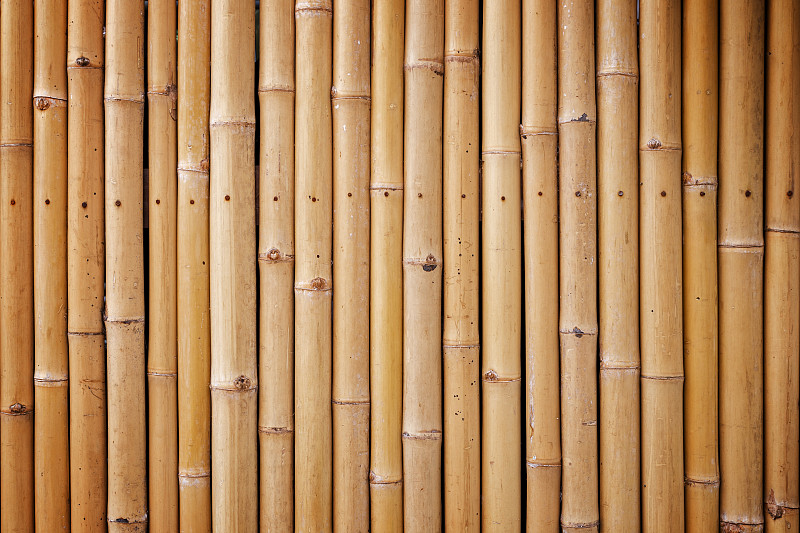特寫的自然竹墻背景與溫暖的色調和vignette圖片素材