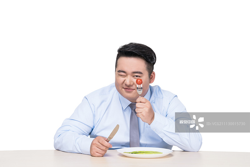 胖子吃蔬菜图片素材