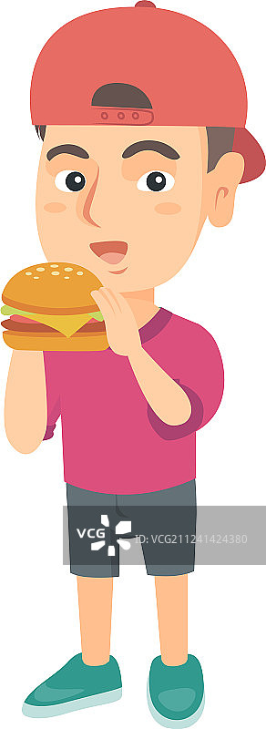 一个白人小男孩在吃汉堡包图片素材