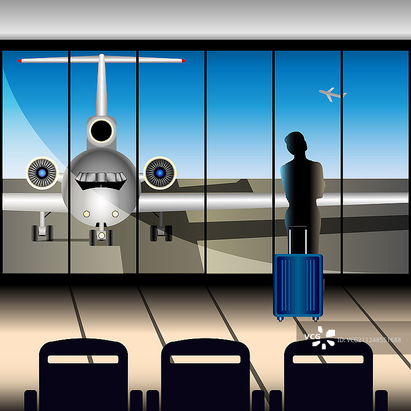 机场的飞机通过一扇大窗户图片素材