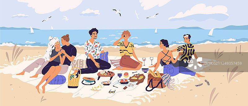 一群快乐的朋友在海边野餐图片素材