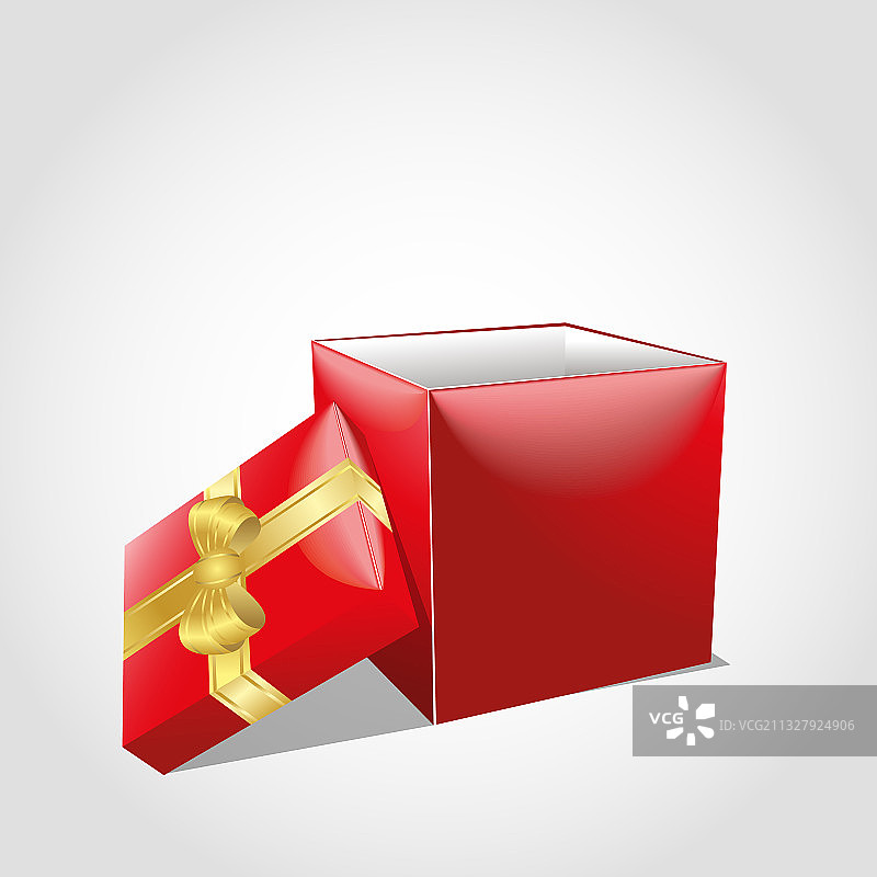 打开的红色礼盒上有金色的蝴蝶结和闪光图片素材