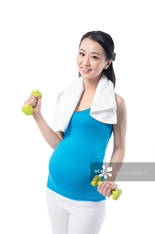 手拿哑铃健身的孕妇图片素材
