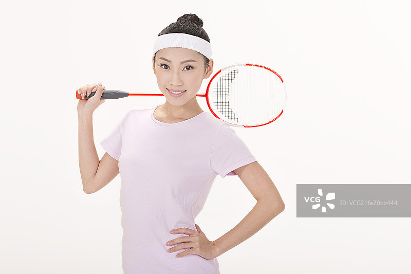 年轻女性打羽毛球图片素材