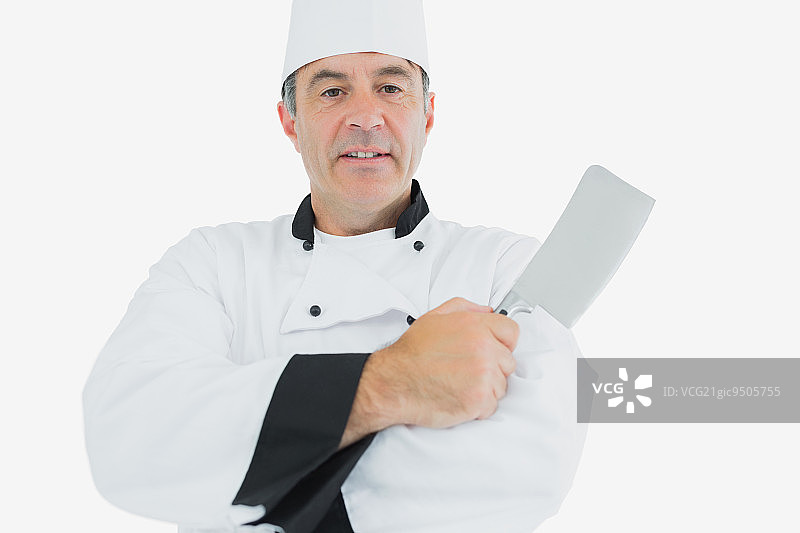 男厨师手持切肉刀的肖像，背景为白色图片素材