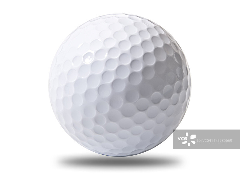 一个白色的高尔夫球悬浮在地面上图片素材