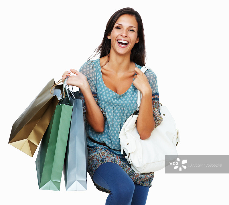 热情的黑发女人拿着购物袋图片素材