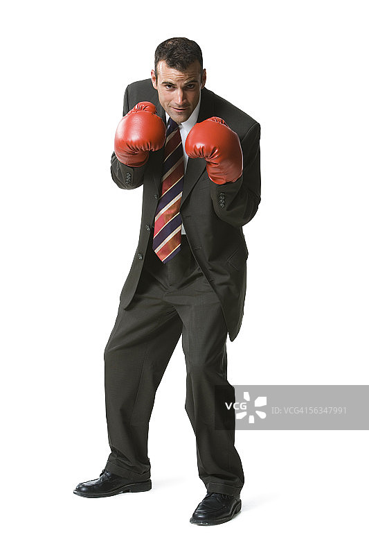 一个戴拳击手套的商人的肖像图片素材