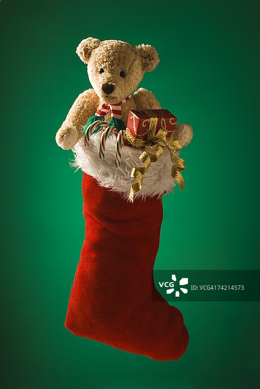 有泰迪熊和拐杖糖的圣诞袜图片素材