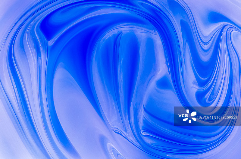 抽象混合蓝色漩涡漆背景。图片素材