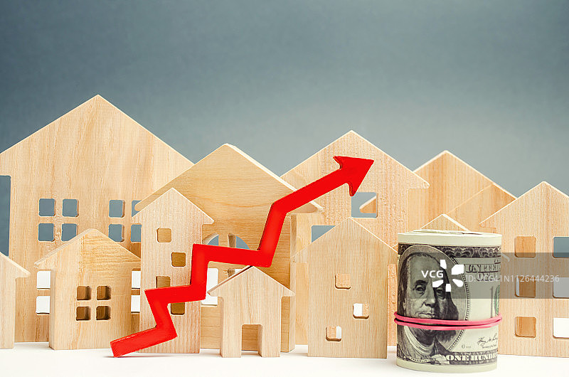 房地产市场增长的概念。房价的上涨。公用事业价格上涨。抵押贷款利率上升，抵押贷款利率上升。房租增加。美元图片素材