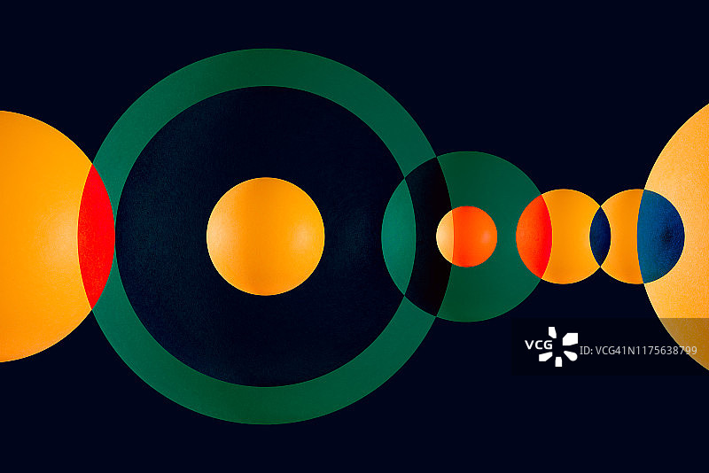 绿色和橙色的圆圈重叠图片素材