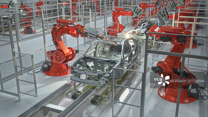 在汽车制造厂焊接车身的工业机器人图片素材