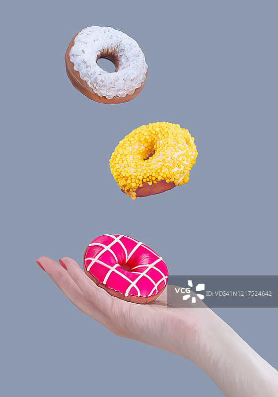 女性手扶粉红甜甜圈。黄白色的甜甜圈在飞。时髦的悬浮。蓝灰色背景图片素材