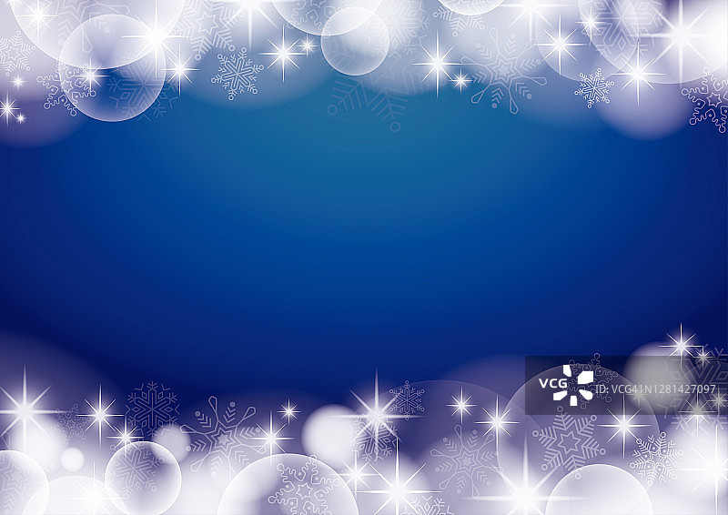 一个蓝色的圣诞背景，有雪，闪光和球形的散景图片素材
