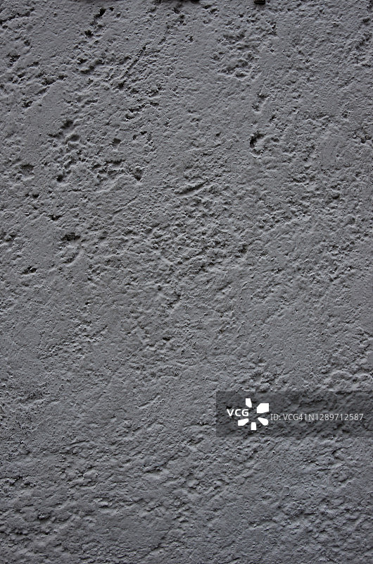 不平整的灰泥墙漆成浅灰色图片素材