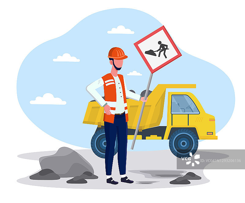 一名男性建筑工人在道路维修附近放置警告标志图片素材