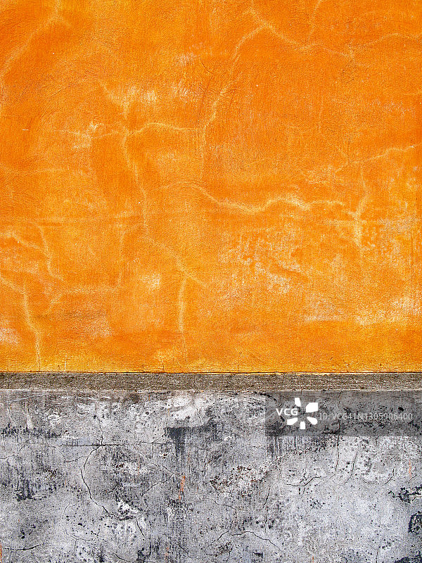 橙色和灰色的混凝土墙，自然的光泽，光线和纹理在马提尼克图片素材
