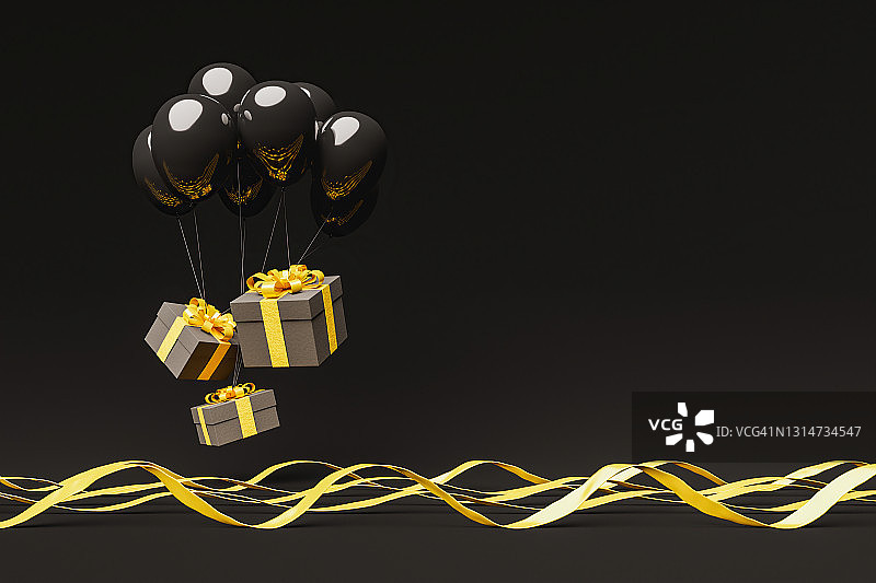 礼品盒上挂着金色的丝带，空中飘着黑色的气球图片素材