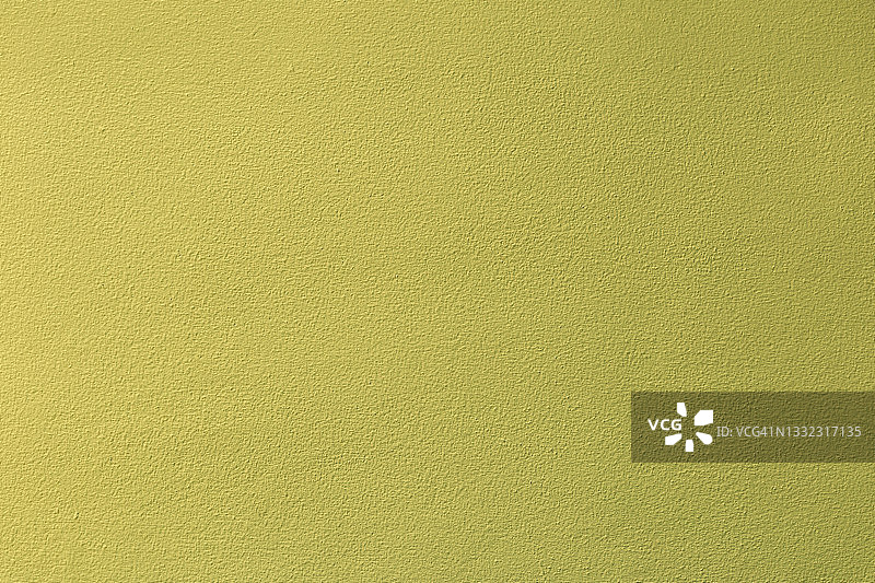 旧的垃圾黄色墙体混凝土纹理作为背景。图片素材