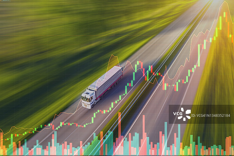 鸟瞰图的卡车驾驶沥青道路上的背景股票图表。货运市场的概念图片素材