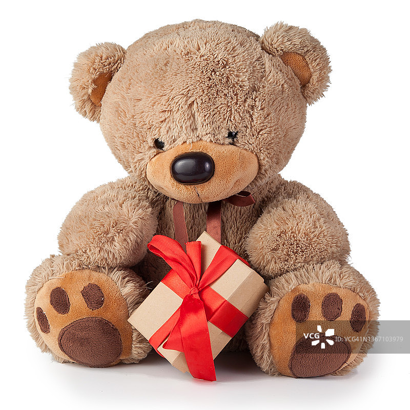 玩具泰迪熊在白色的背景上送礼物图片素材