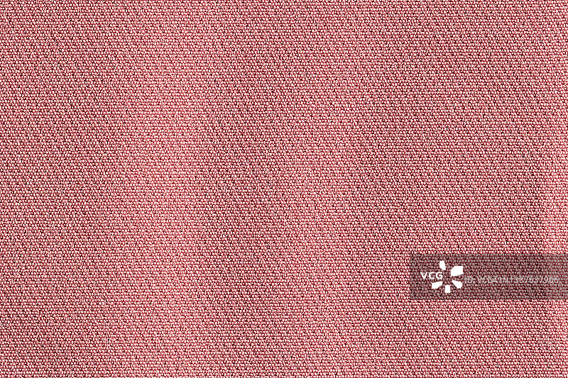 粉红色面料，布料聚酯纹理和纺织品背景。图片素材