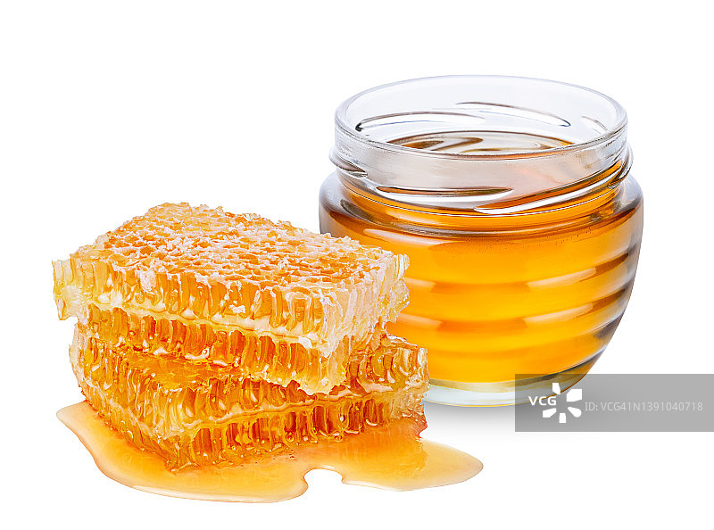 白色背景的蜂蜜和蜂窝状的罐子图片素材