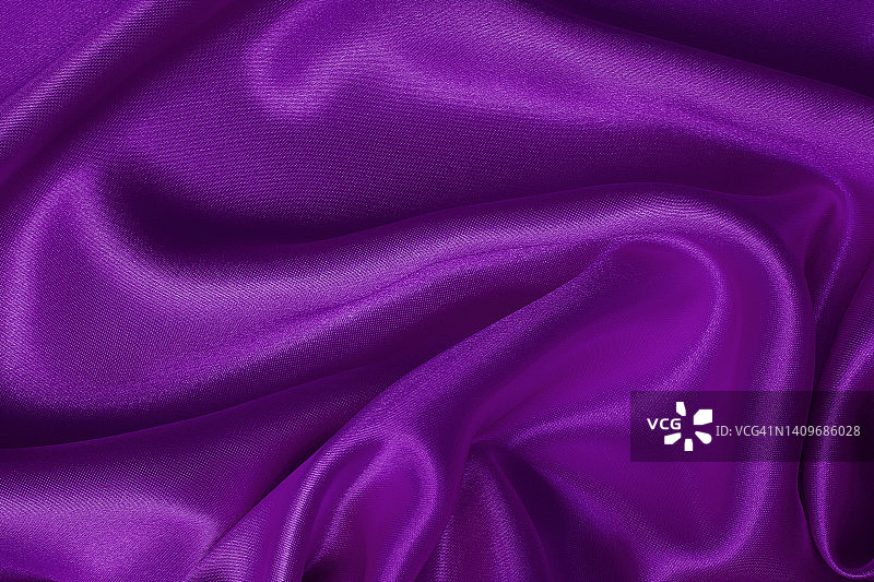 深紫色面料纹理背景，细节丝质或亚麻布图案。图片素材
