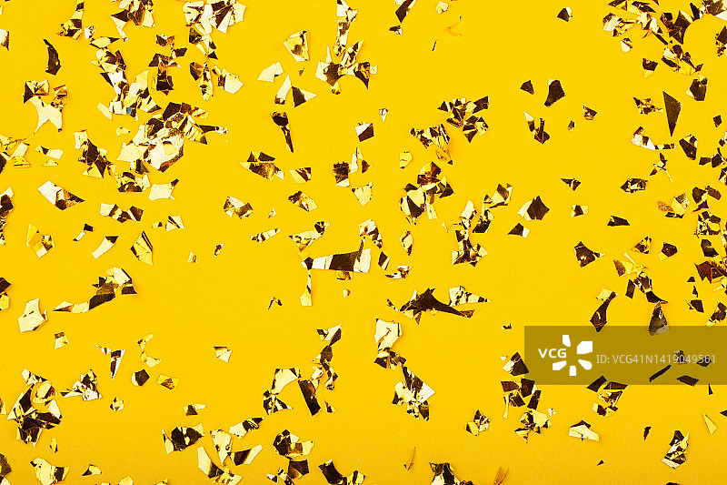 节日黄色的背景与金色的闪光。图片素材