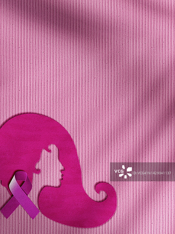 剪纸作品中的乳腺癌意识丝带图案图片素材