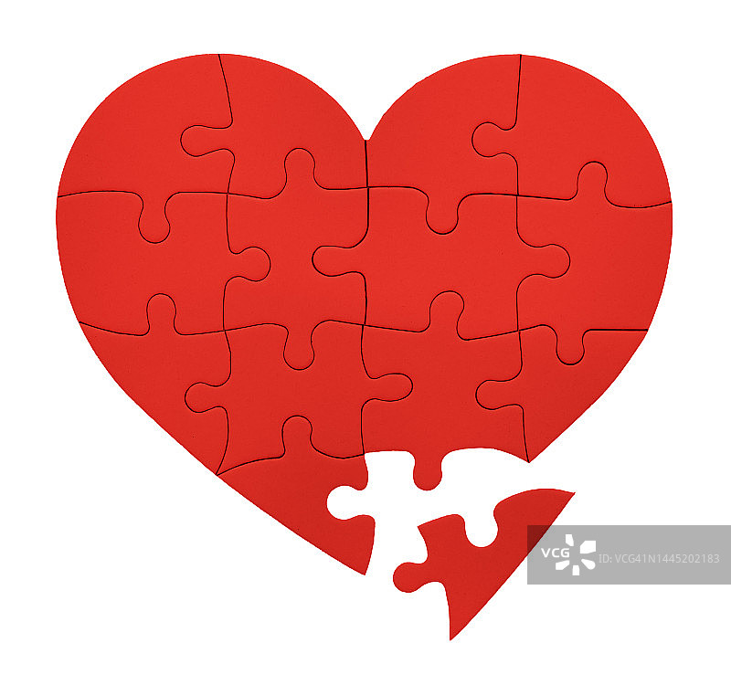 浪漫拼图的最后一块:鲜红色的心形拼图图片素材