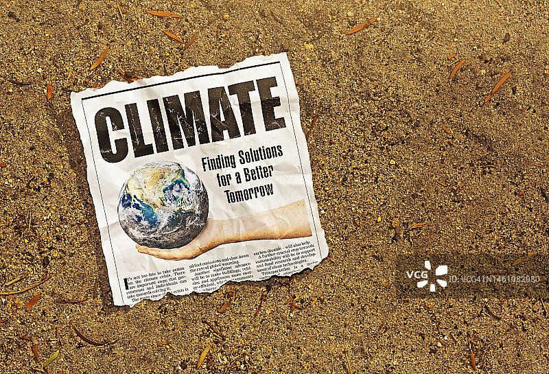 “气候”，大报纸的标题是关于利用可再生能源和其他技术寻找全球变暖的解决方案图片素材