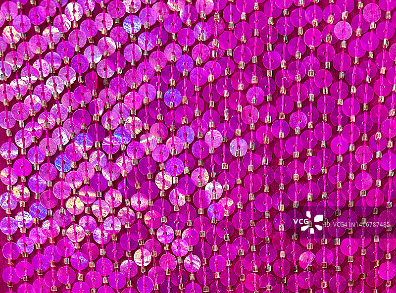 多色调的粉色亮片在织物上图片素材