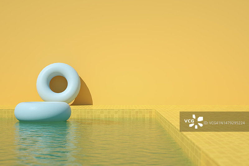 充气游泳圈和游泳池，黄色背景的暑假旅游概念图片素材