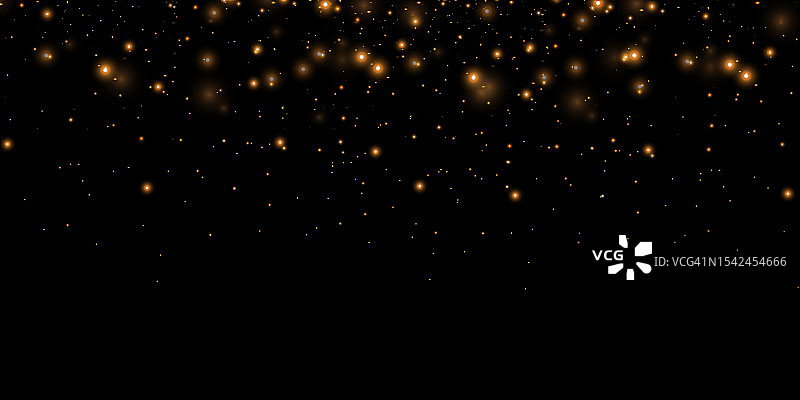 金色的火花和金色的星星闪耀着特殊的灯光效果。图片素材