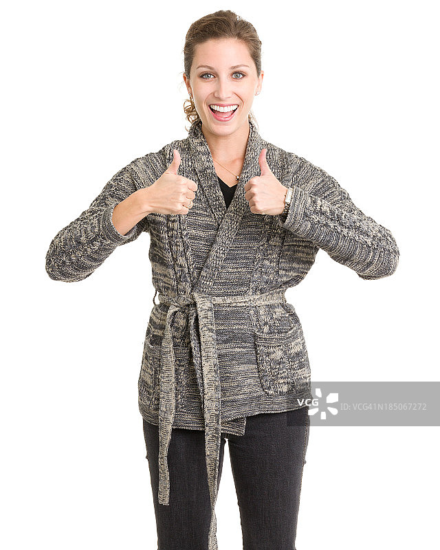 快乐的年轻女人竖起两个大拇指图片素材