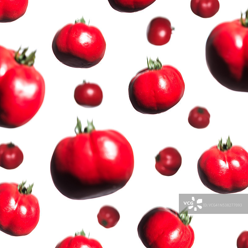 落在白色背景上的红色番茄图片素材
