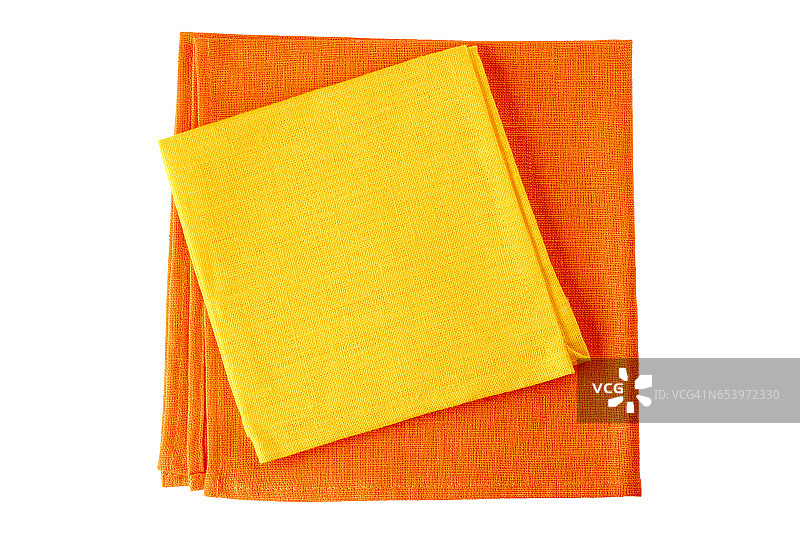 两张彩色的餐巾，黄色和橙色，在白色上图片素材
