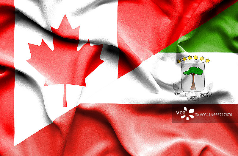 挥舞着赤道几内亚和加拿大的旗帜图片素材