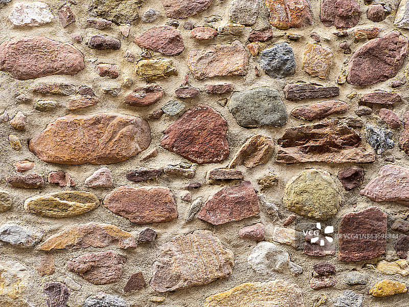 用棕色的石头完成水泥墙面的设置图片素材