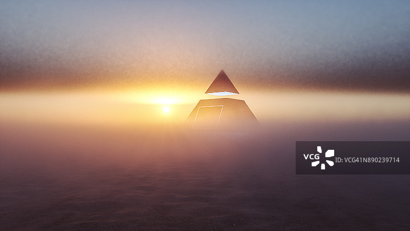 日落时分沙漠中的神秘外星金字塔图片素材