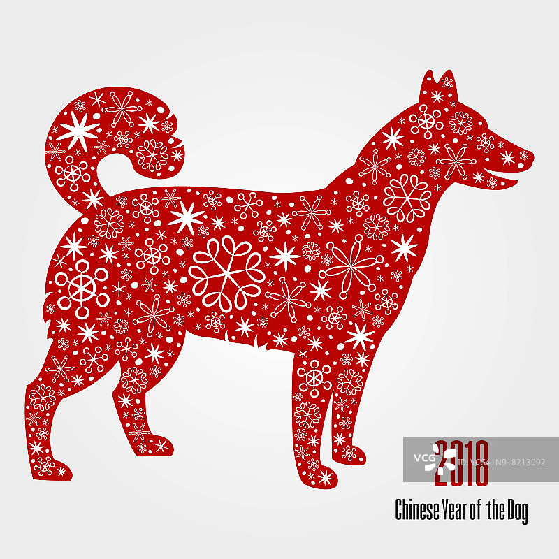 狗红色的剪影与雪花。图片素材