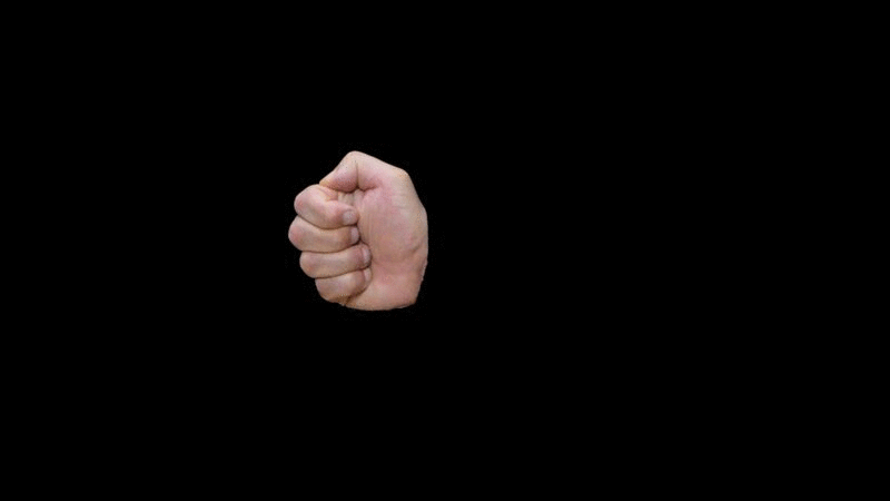 一个男人的手在黑色背景下竖起大拇指的特写图片下载