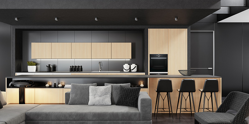 豪华的黑色和浅色木材室内客厅与现代极简主义意大利风格的开放式空间厨房与大长厨房岛。图片素材