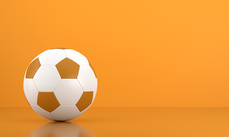足球在橙色背景图片下载