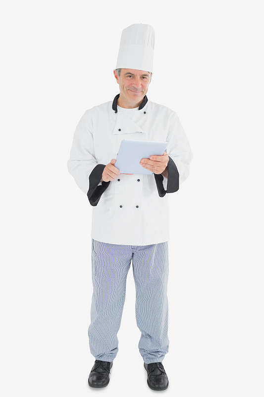 男厨师手持数码平板电脑的肖像图片素材