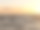 日落时海浪和海鸥的大海摄影图片