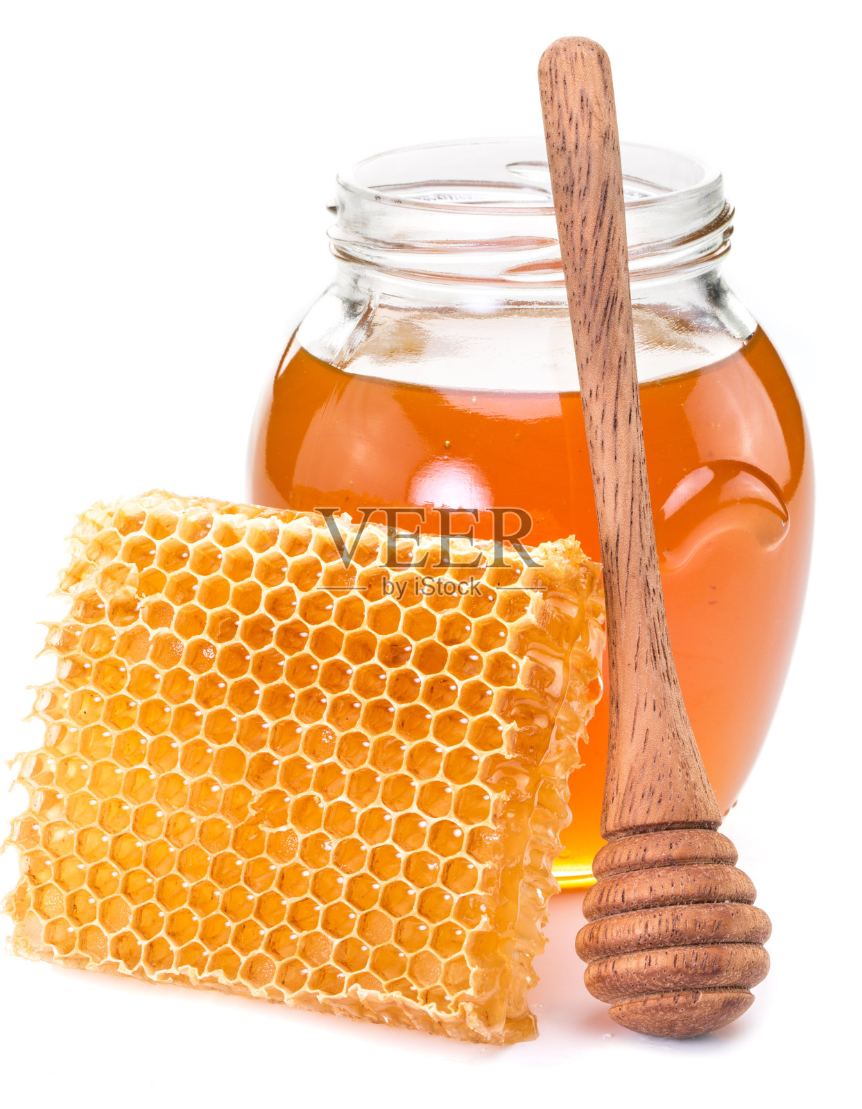 罐子里装满了新鲜的蜂蜜和蜂窝。照片摄影图片