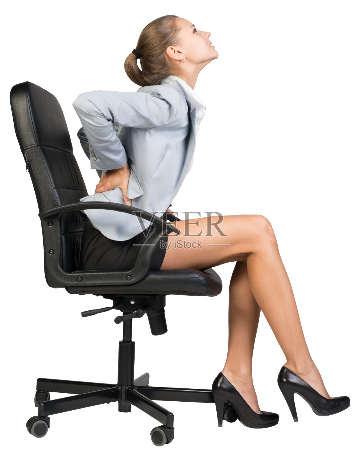 坐在办公椅上导致腰痛的女商人照片摄影图片